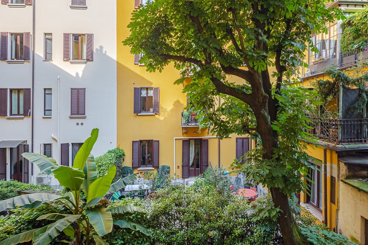The tree-lined inner courtyard of the period palazzo