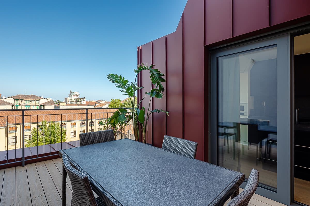 The penthouse's private terrace over the rooftops of Milan