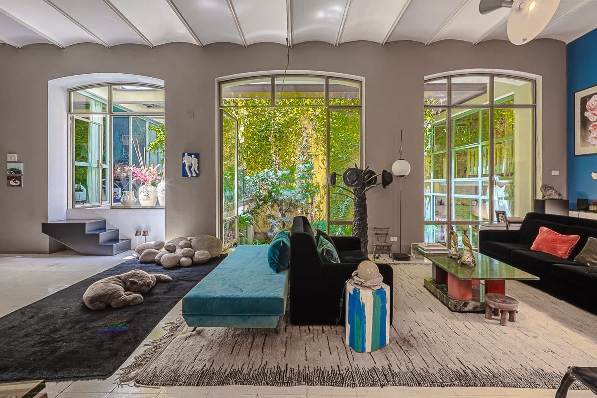 The loft's living room opening onto its inner garden