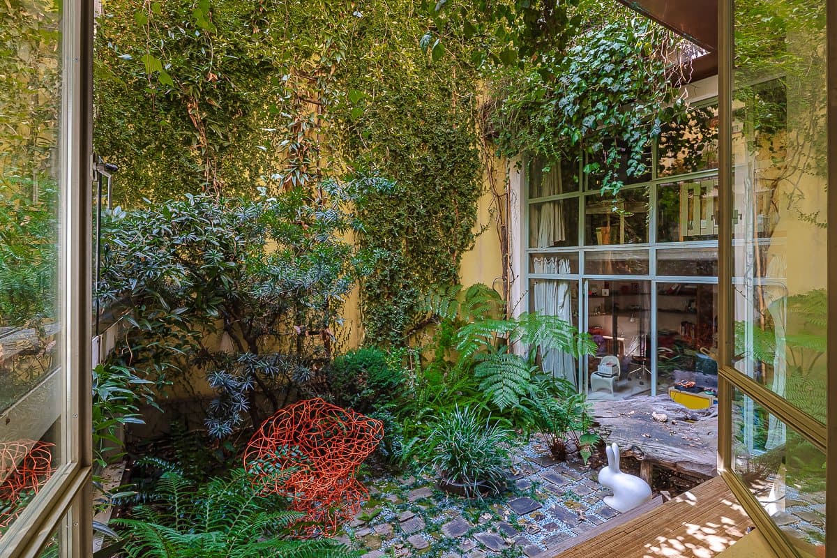 The loft's private garden, deep in greenery
