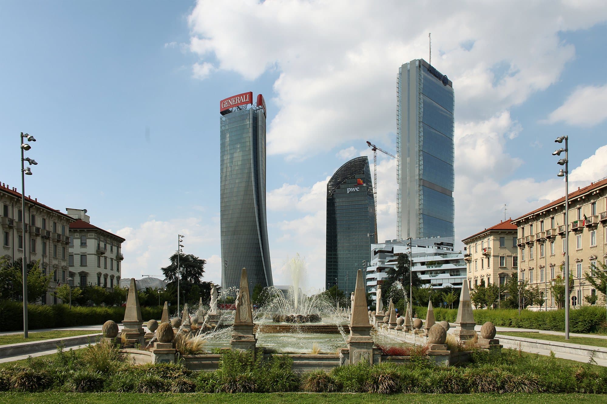 The CityLife towers beyond the fountain of Piazza Giulio Cesare